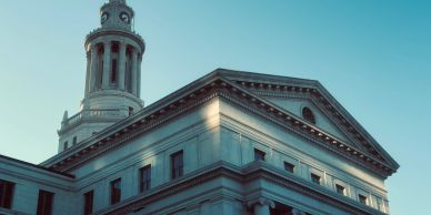 Classical clock tower atop a historic building.