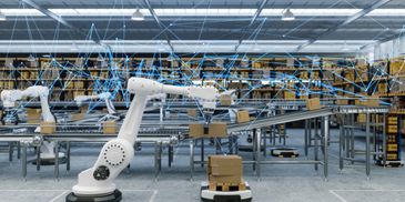 Automated warehouse with robotic arms and conveyor belts.