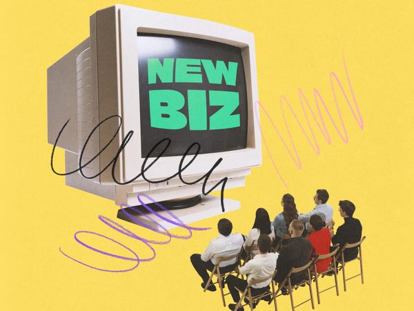 People watching a vintage computer screen displaying 'NEW BIZ' on yellow background.
