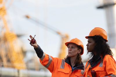 A picture of two women in construction on site wearing PPE 