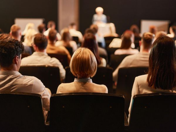 People listen to a presentation