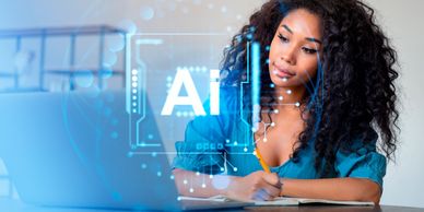 A woman studying AI concepts with a laptop and notebook.