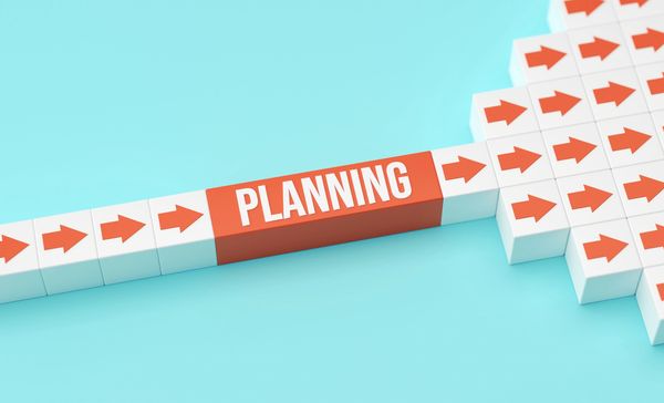Arrow blocks with one labeled "PLANNING" on a blue background.
