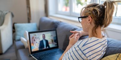 Woman attending a video call on her laptop at home.