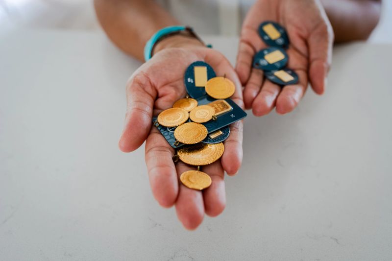 Businesswoman holding golds for saving