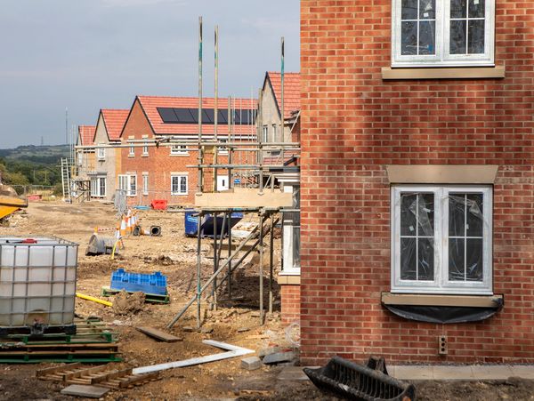 New houses under construction in a developing neighborhood.