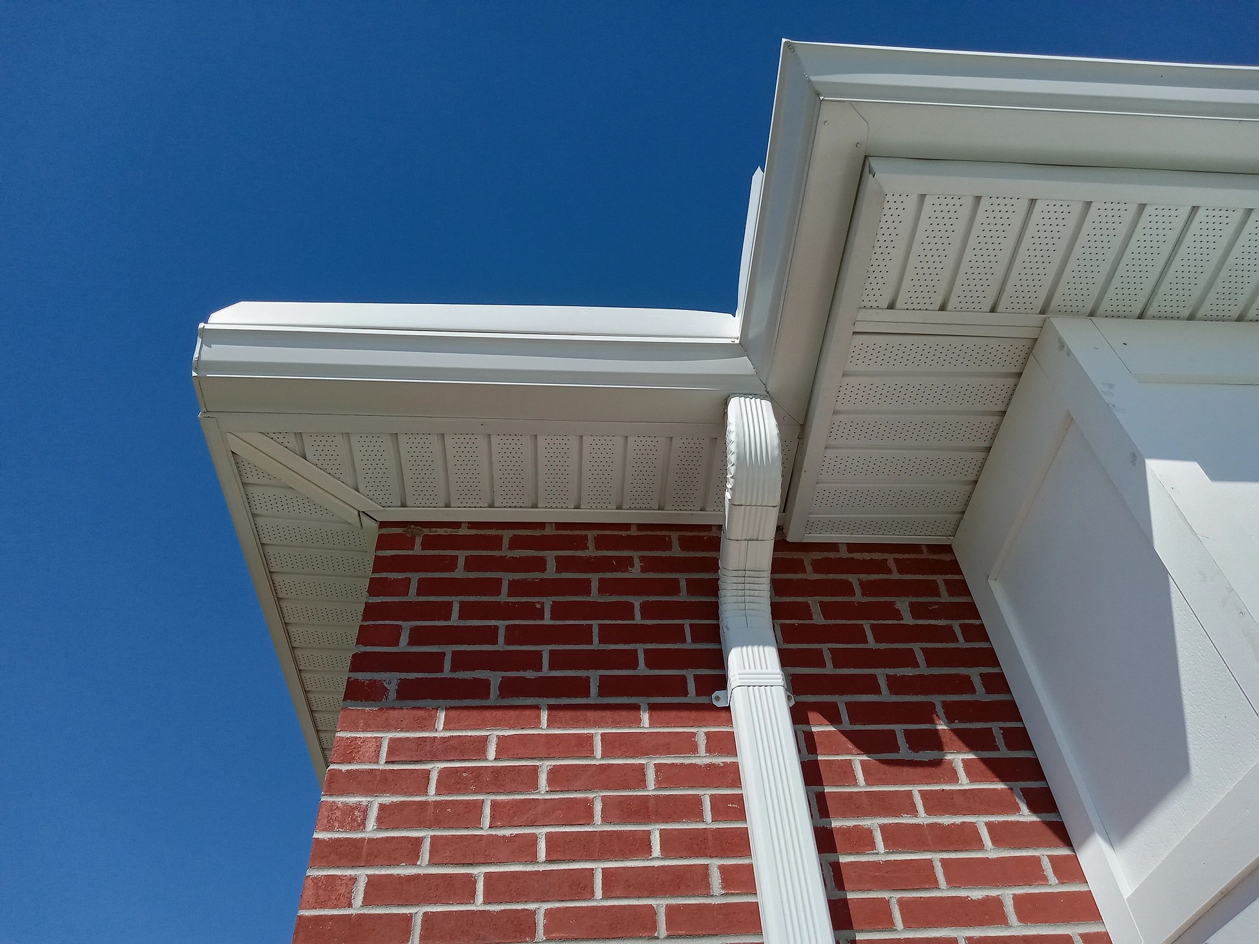 Professional gutter installation on a suburban Dayton home.