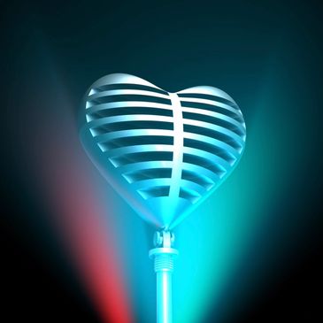 Heart-shaped microphone glowing in blue and red light against a dark background.