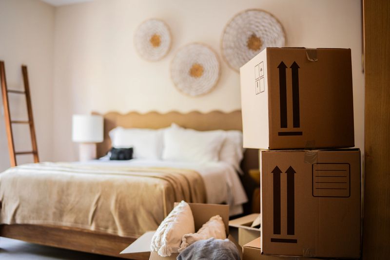 Bedroom with cardboard boxes