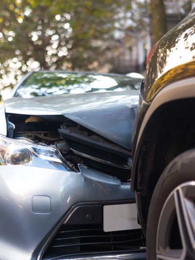 A car crashed to the rear of another vehicle. 