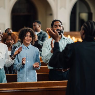 People engaging in a lively church worship service.