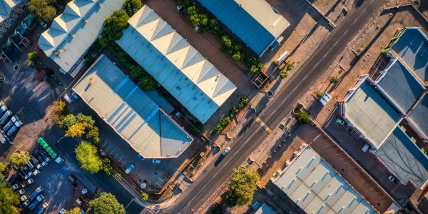 Aerial view of buildings and a road.