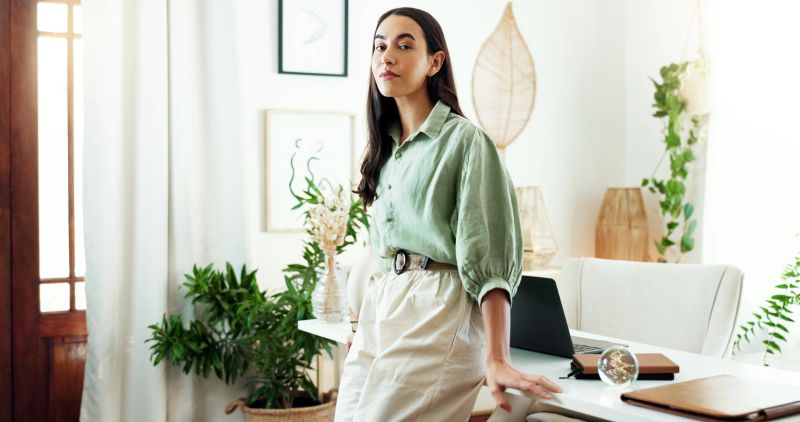 Office, interior designer and portrait of business woman with confidence, pride and startup career. Architecture, professional and person at desk for decoration company, creative job and opportunity