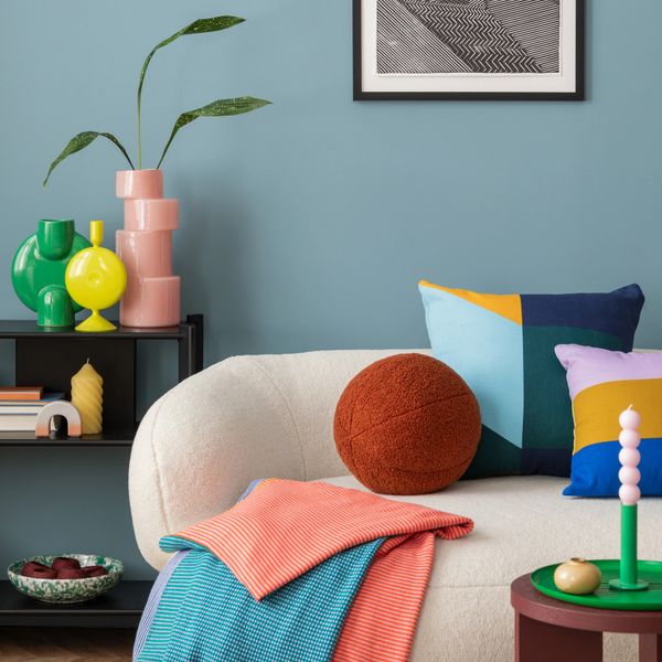 Cozy modern living room with colorful pillows and decor accents.