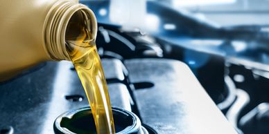 oil being poured out of container 