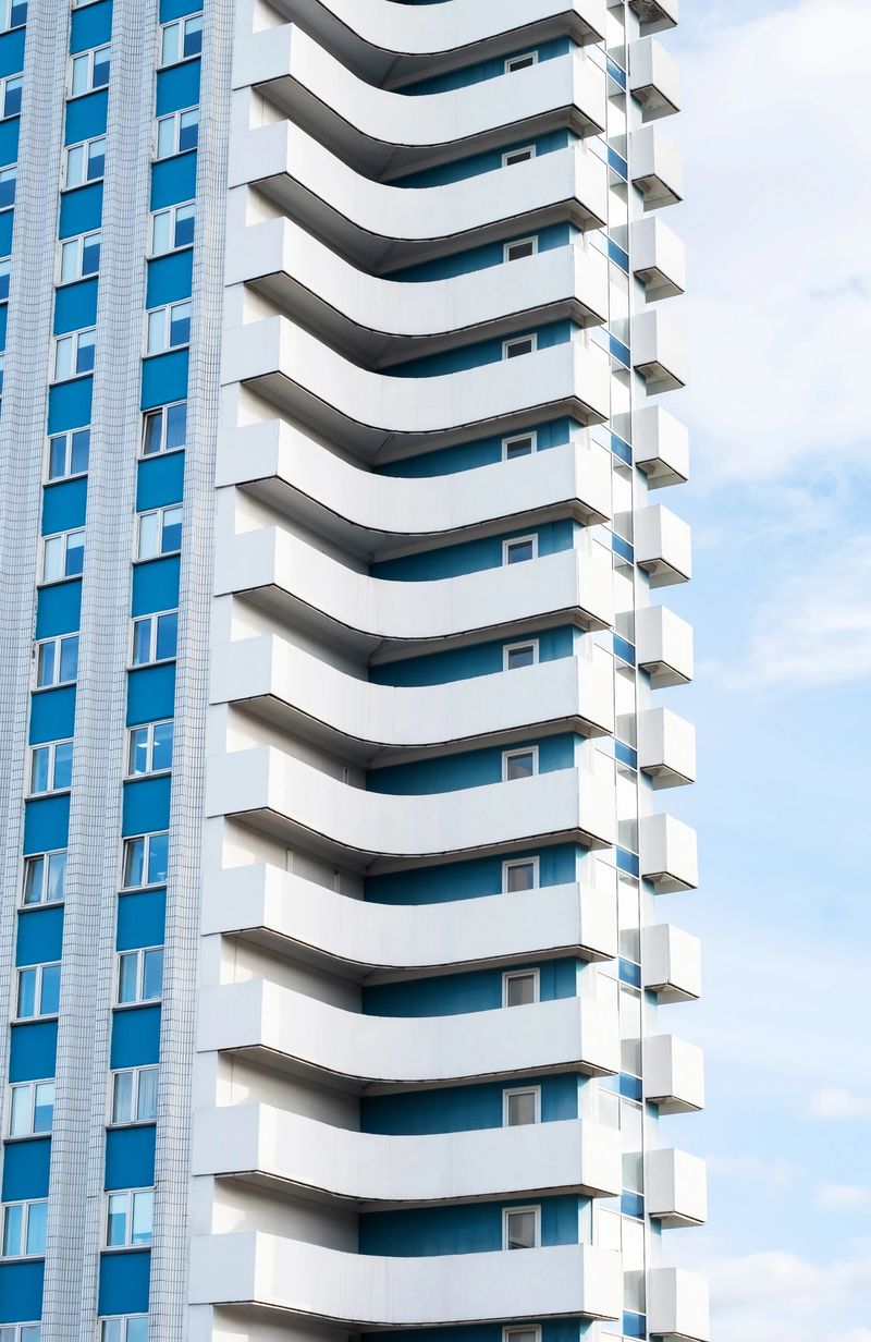 Modern apartment building featuring unique balconies.