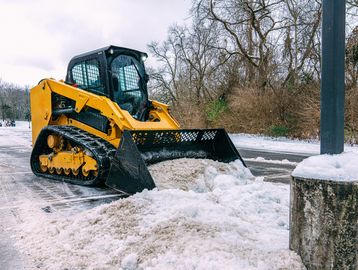 Winnipeg commercial parking lot snow removal with skid steer