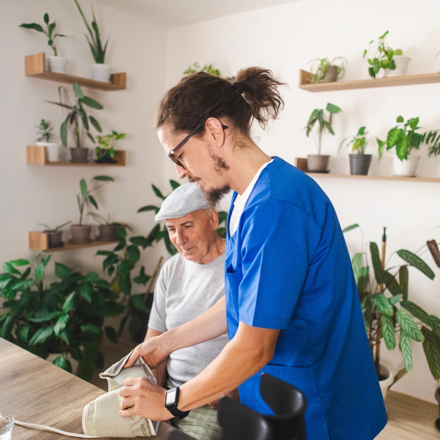 A caregiver assisting an elderly woman
