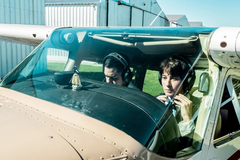 Flight instructor teaching student on a private airplane