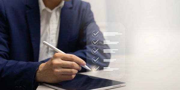 Person using stylus on tablet with checklist overlay.