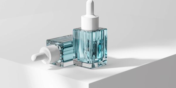 Blue glass bottle with white dropper