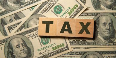 Tax written in wooden blocks.