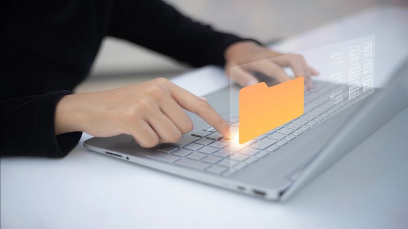 A Document Management System (DMS) simplifies document handling by providing a centralized hub for efficient document creation, storage, organization, and retrieval.