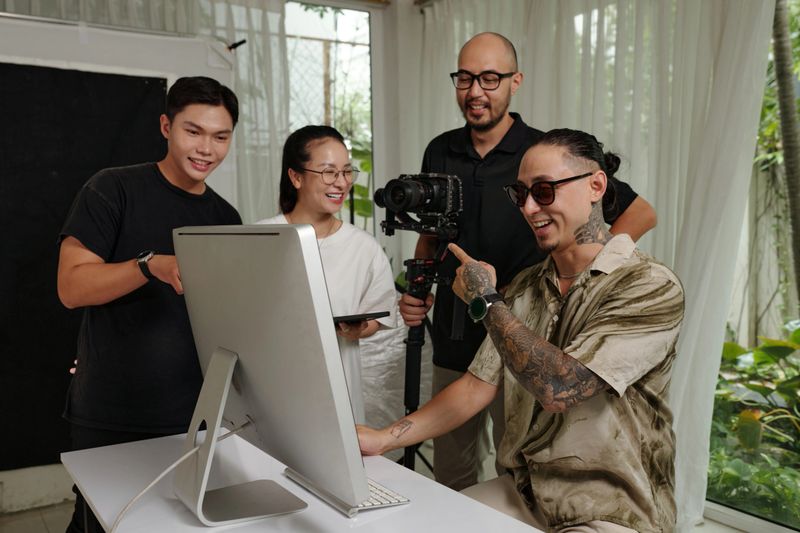 Director discussing script of shooting with his crew in office
