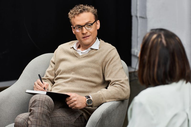 A journalist conducts an insightful interview with an invited guest in an inviting studio atmosphere.
