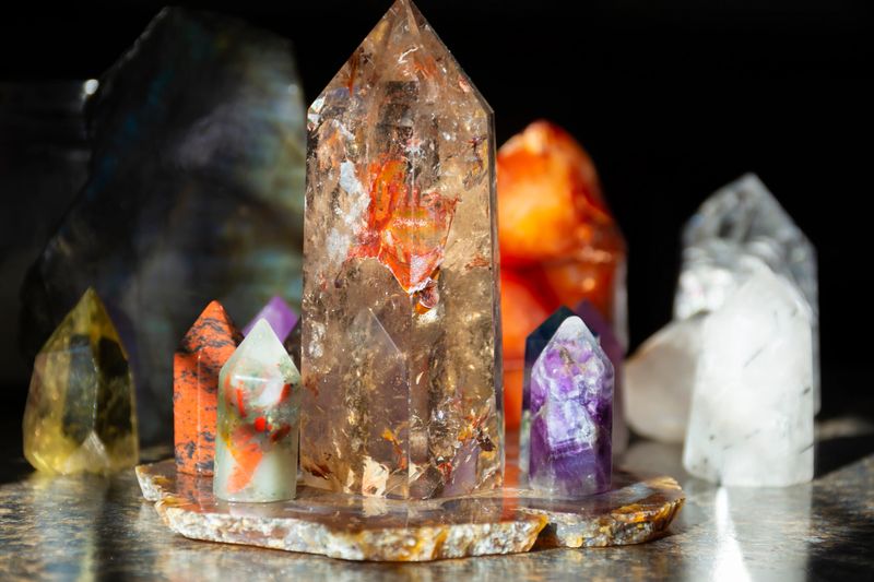 An image of several mixed crystal towers on an agate charging plate.