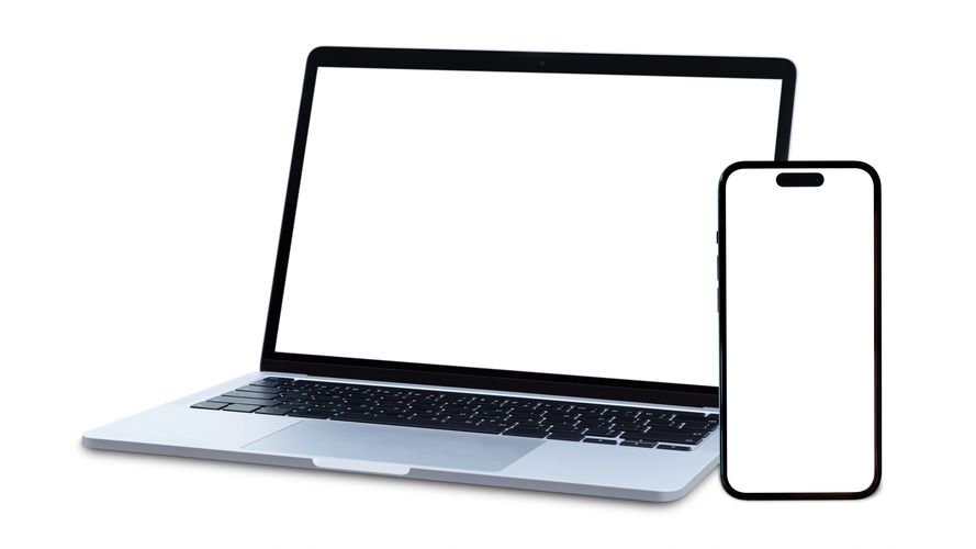 Laptop and smartphone with blank white screens isolated on white.
