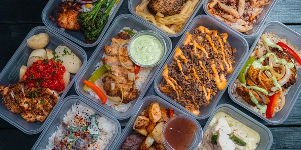 Assorted meal prep containers with various dishes.