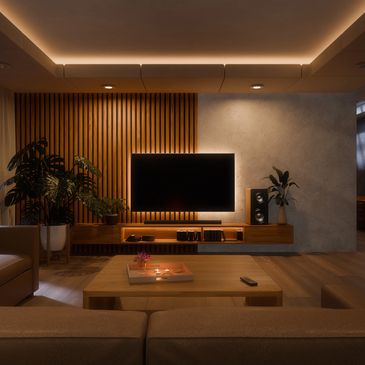 Cozy modern living room with warm lighting and wall-mounted TV.