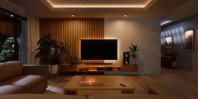 Cozy modern living room with warm lighting and wooden accents.