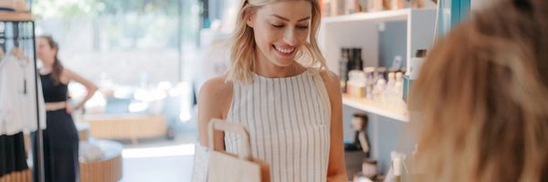 Woman smiling while shopping in a store.