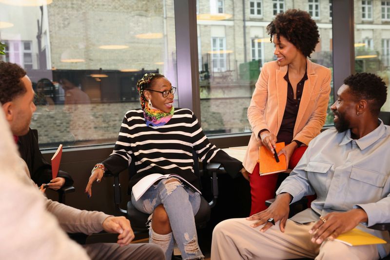 Diverse business people talking in office