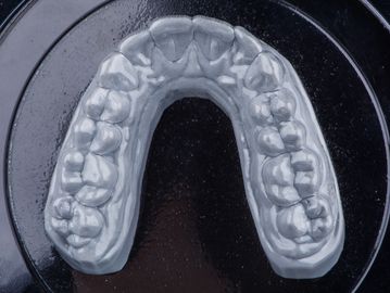 Essix retainer being fabricated.
