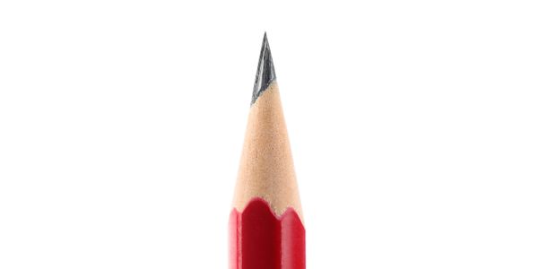 Close-up of a sharpened red pencil tip on a white background.
