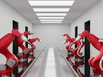 Red robotic arms lined up on both sides of a conveyor belt in a sterile industrial setting.
