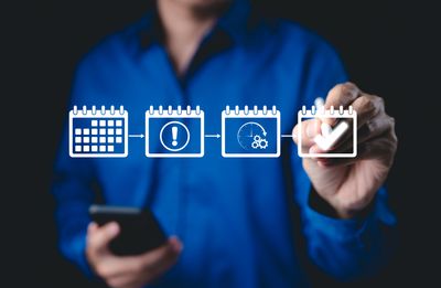 Person illustrating a step-by-step calendar planning process with icons.