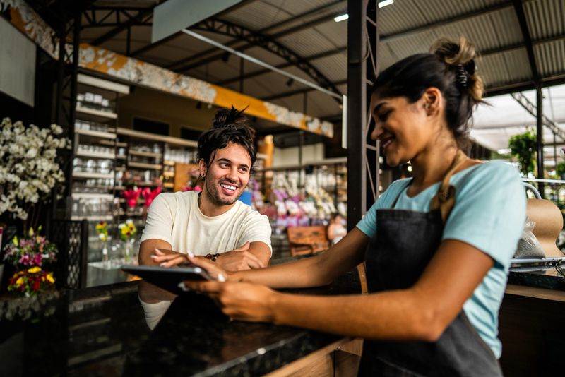 Customer talking with saleswoman at a garden center
