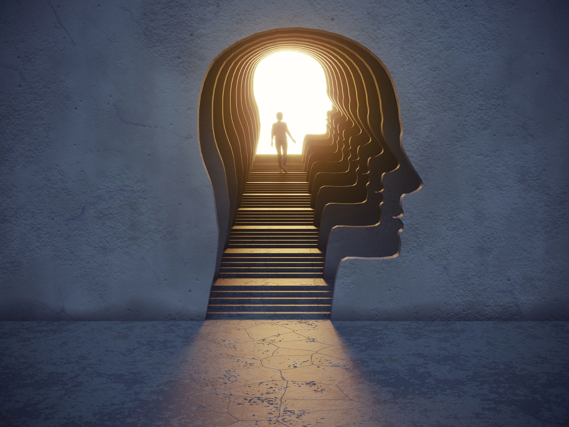 A person walking up stairs inside a head-shaped tunnel toward bright light.