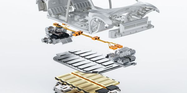 Exploded view of an electric vehicle showing its battery pack and chassis components.
