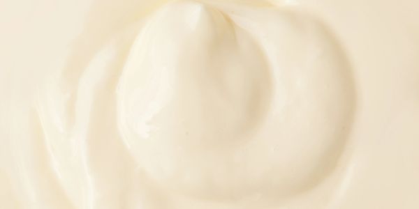 Close-up of creamy white texture, likely yogurt or cream.