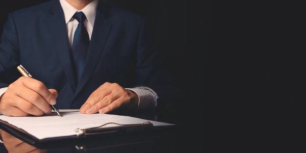 executive signing legal documents and tenders for secure courier delivery to Almaty and Astana