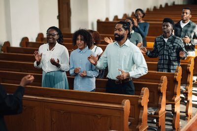 People worshiping in a church sermon.