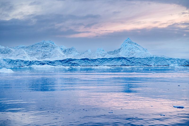 Iceberg floating in the famous Ice Fjord outside Ilulissat in western Greenland which is an UNESCO World Heritage Site due to the Ice Fjord