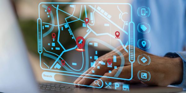 Person using a digital map interface on a laptop.