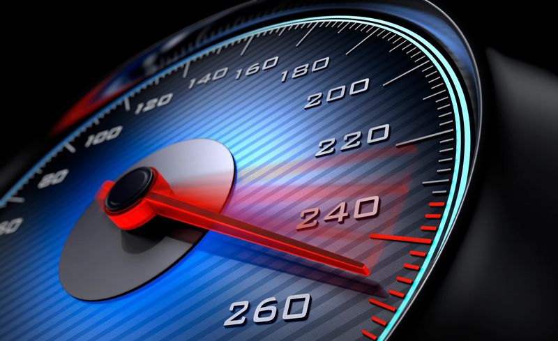 Dark stylish speedometer with blue light and red needle moving to 260 km/h