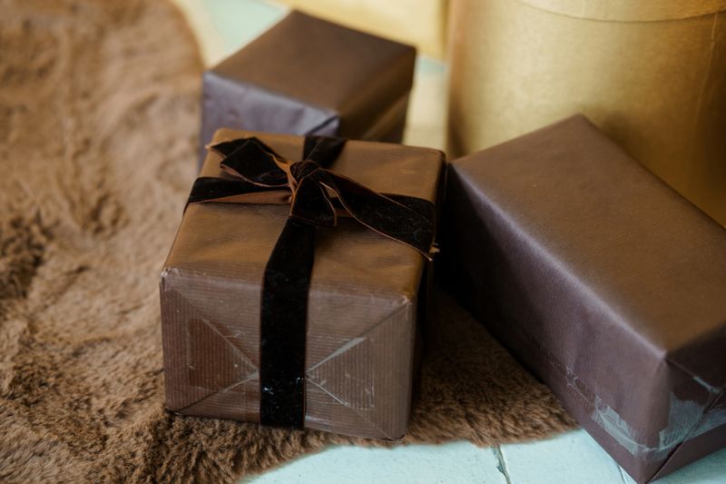 Elegant Wrapped Gifts on a Soft Texture Background.